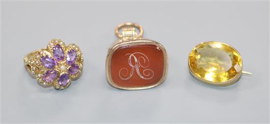 A Victorian style 9ct gold, amethyst and split pearl cluster ring, a 19th century carnelian set fob seal and a gem set brooch.
